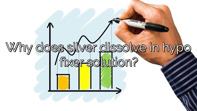 Why does silver dissolve in hypo fixer solution?